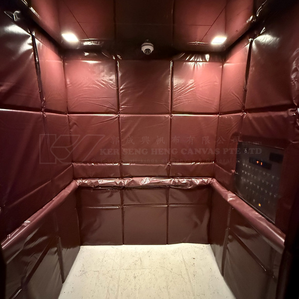 Passenger lift interior with burgundy padded protective panels on the side wall | KSH CANVAS